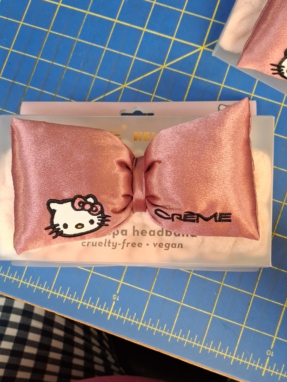 The Crème Shop Hello Kitty Plush Spa Headband is a pink satin headband NWT